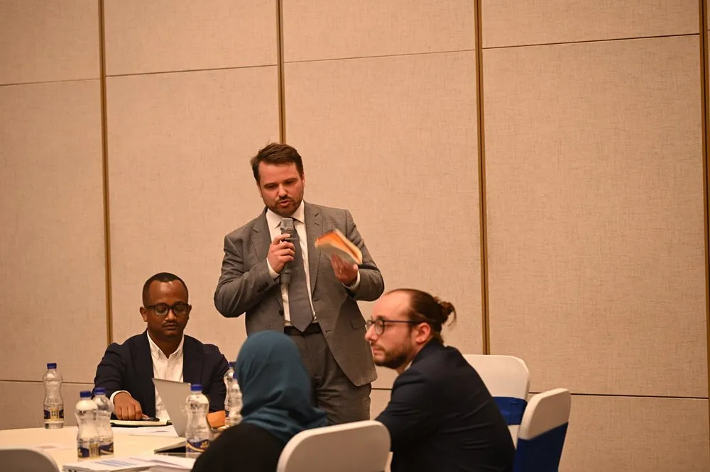 Man speaking infront of an audience