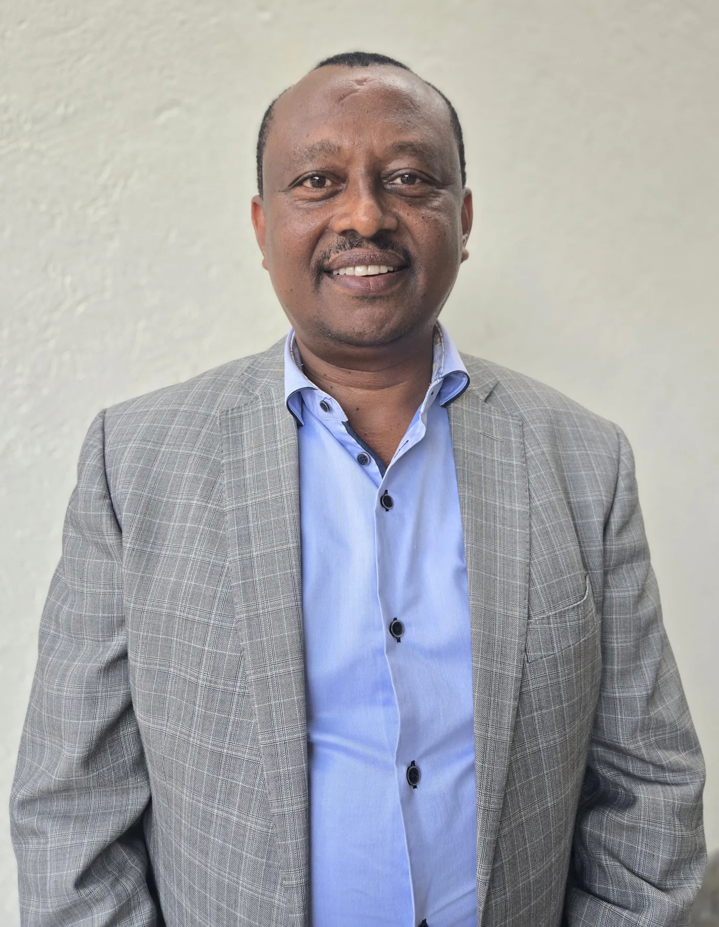 Man in a suit posing for a photo
