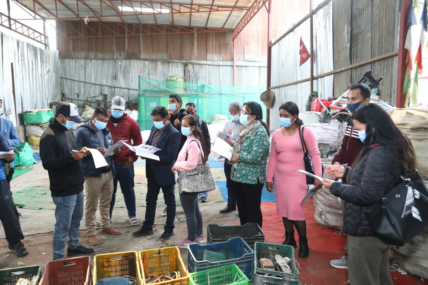Participants review the action checklist at the waste management site.