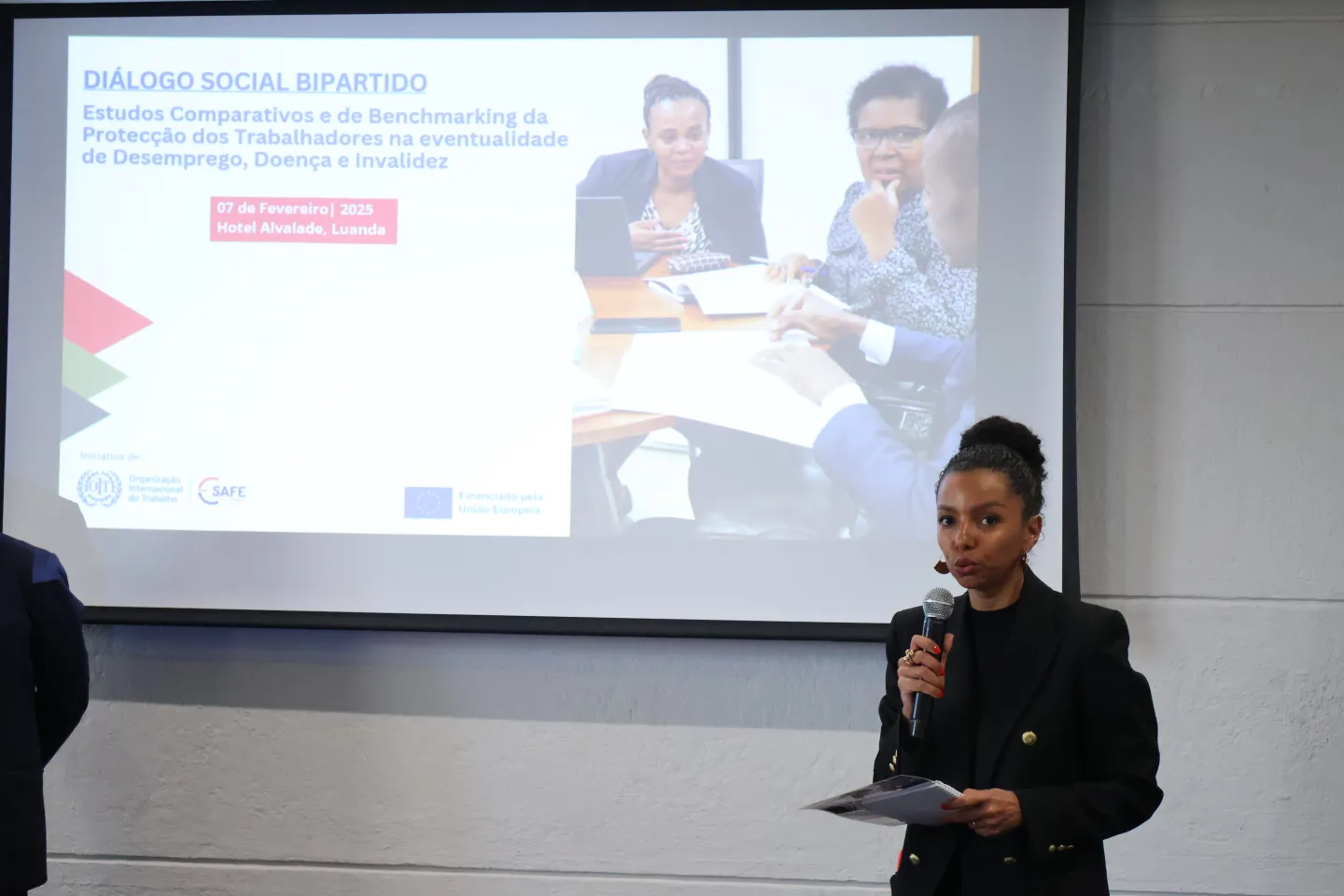 A woman, Denise Monteiro, doing the open remarks over the bipartite dialogue event.