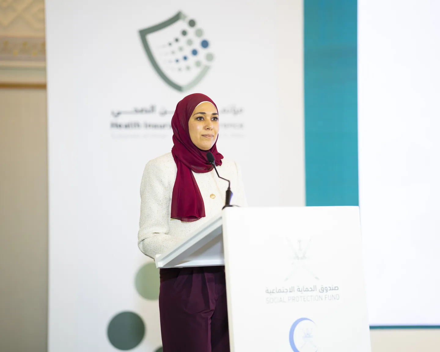 a woman speaking on a lecturn