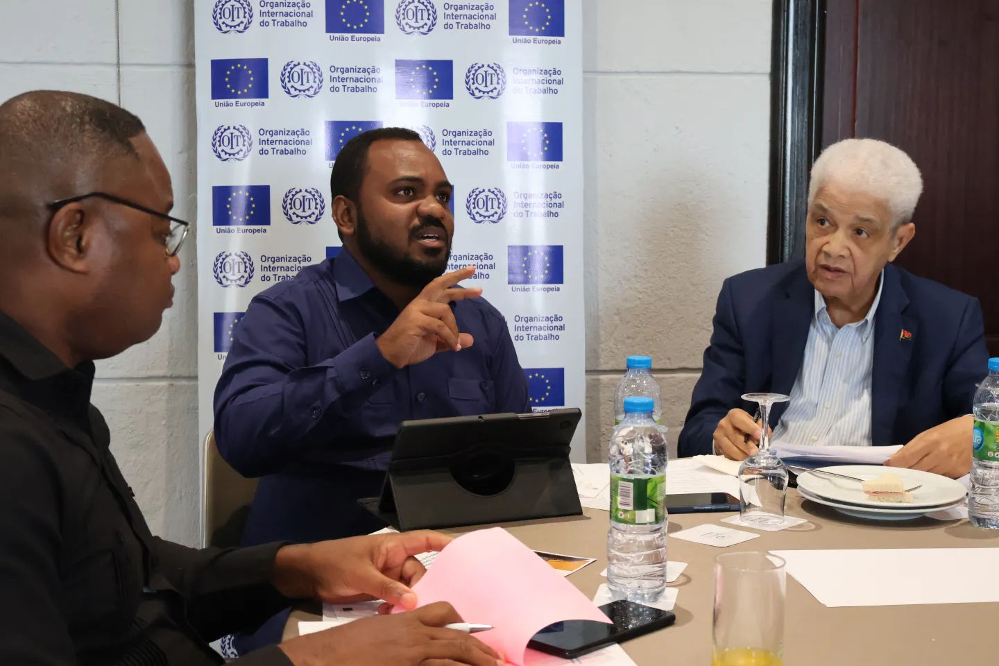 Three men participants on debate during the event.