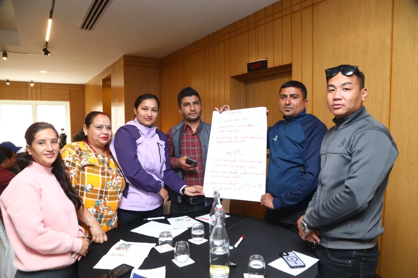 A group of participants presents their findings from the group exercise.
