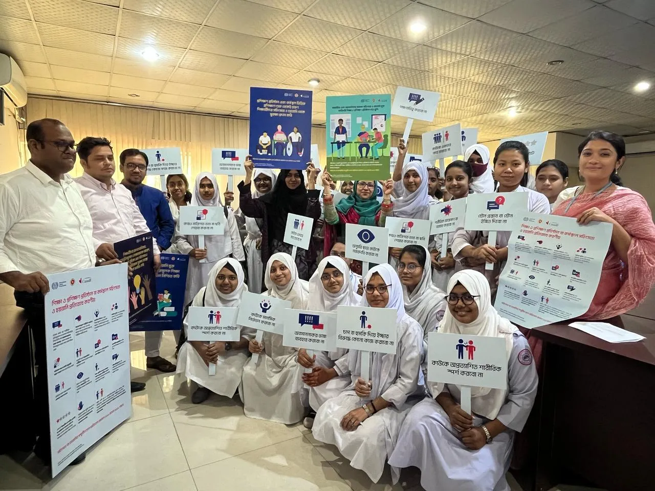 Teachers and students with information materials