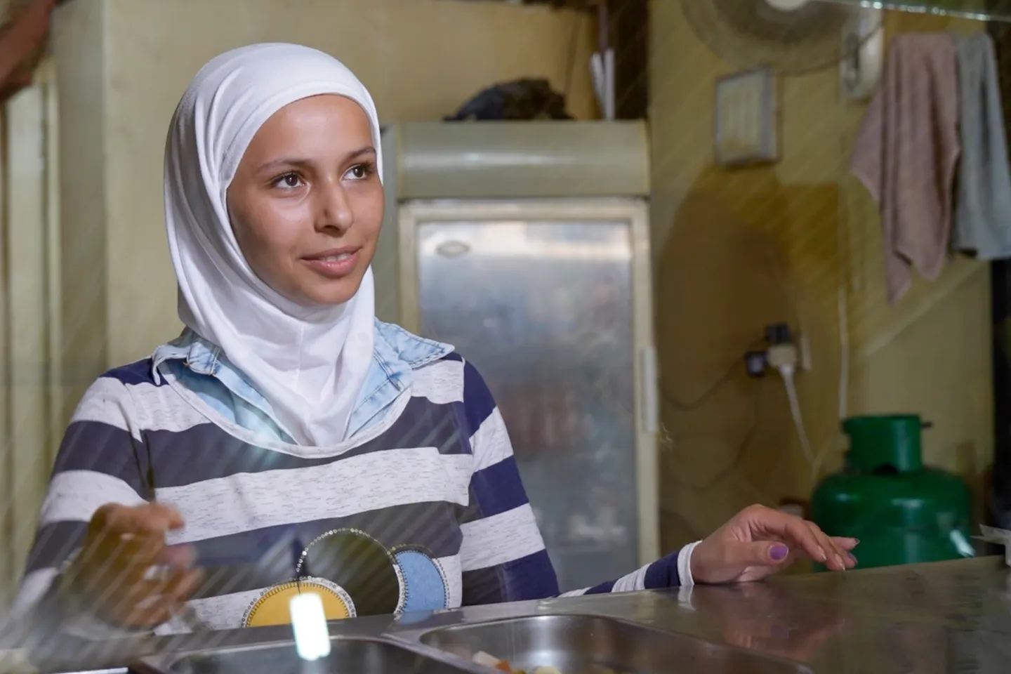 a woman inside her own restaurant