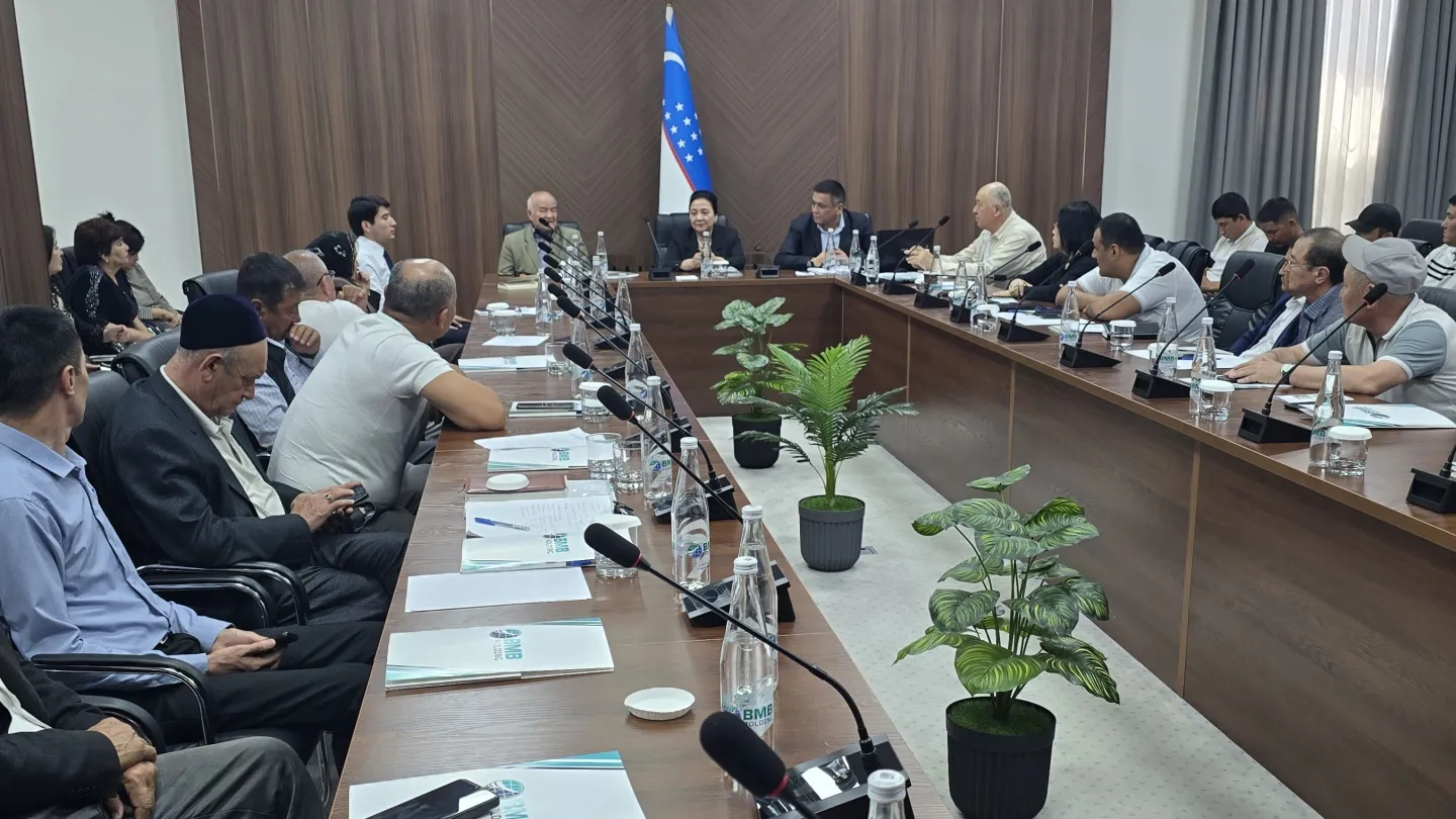 Group of people sitting at a U-shaped table