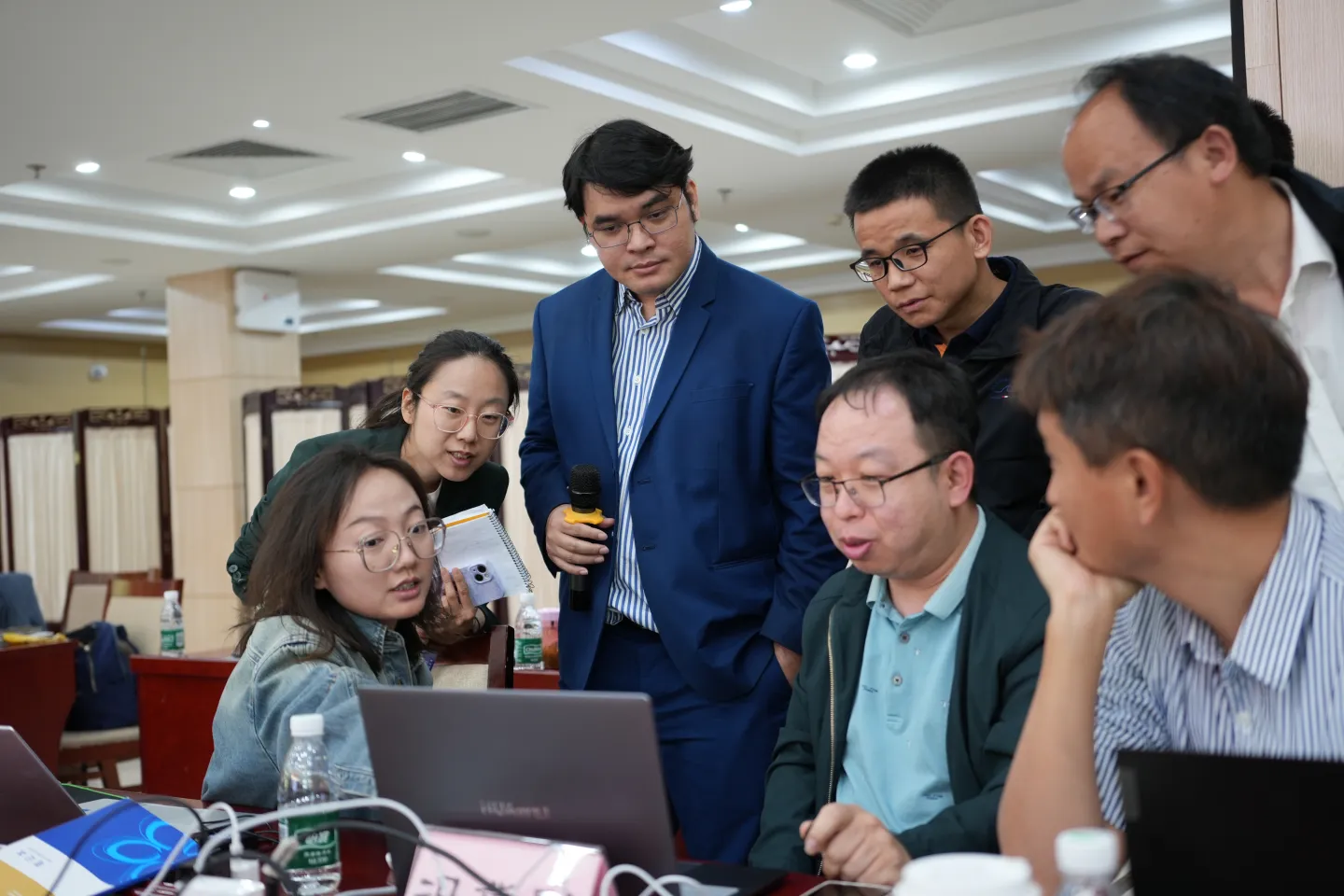 Trainers discussing the group project, actuarial training in social security in China, Apr 2025