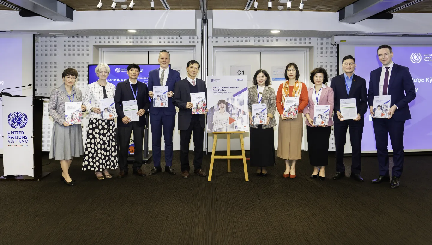 Tripartite partners, donor and the ILO with one of the reports