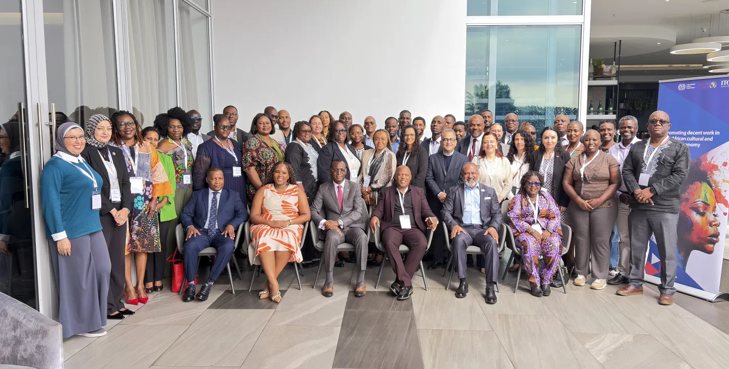 Participants from across seven African countries stand for a group photo at the high-level event on promoting decent work in the African cultural and creative economy.