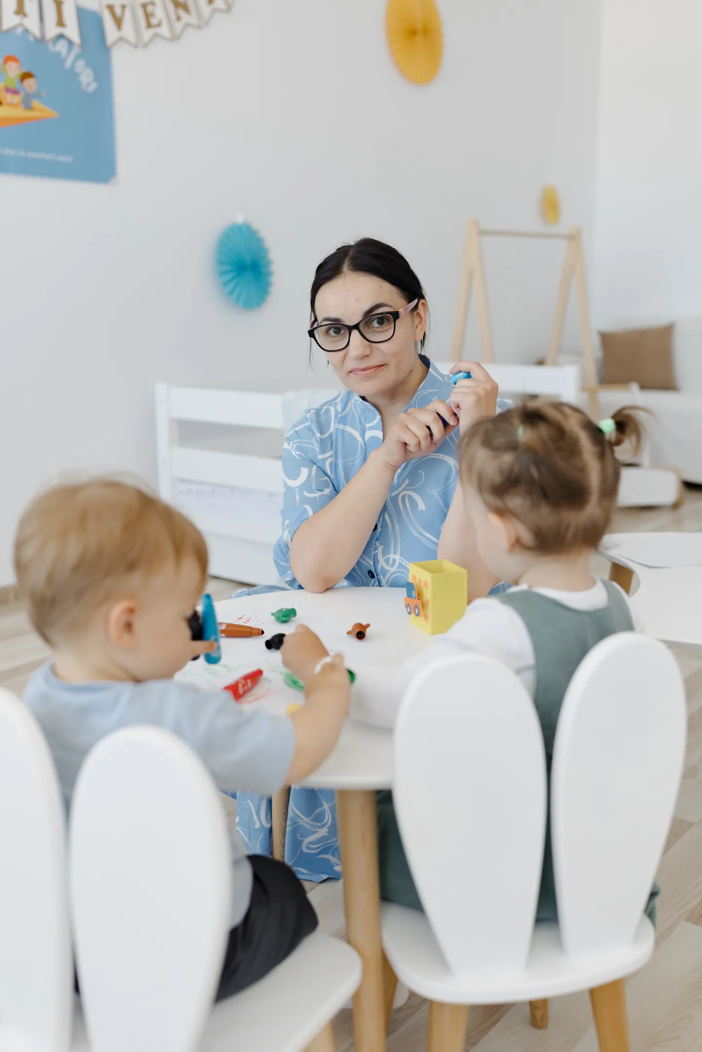 Woman in childcare facility with children 