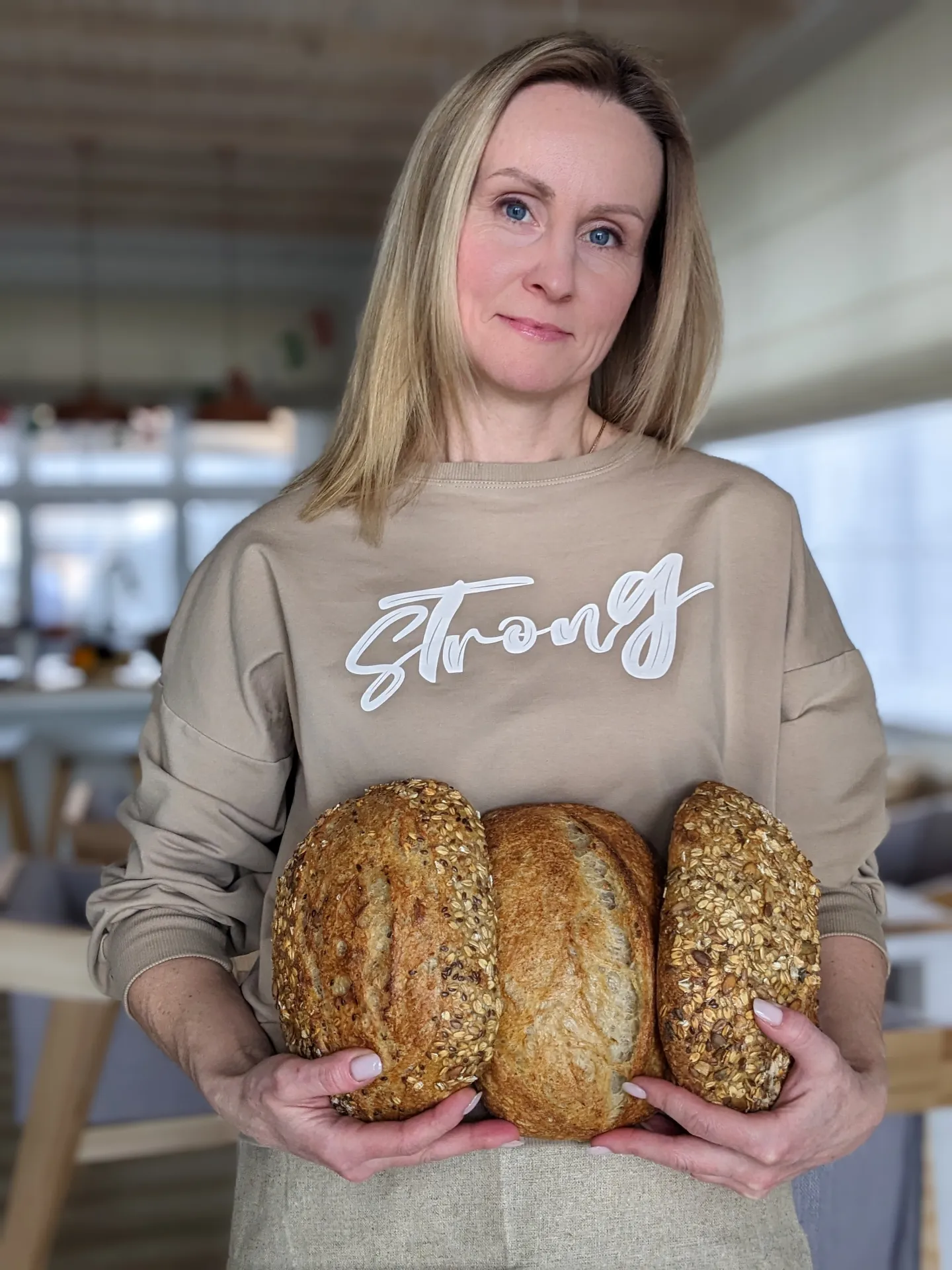 Woman with loaves of bread