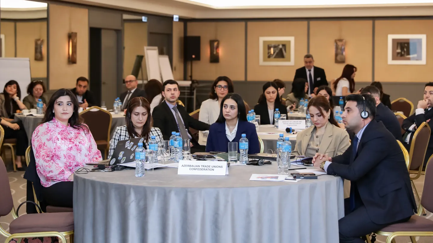 Participants sitting at round tables