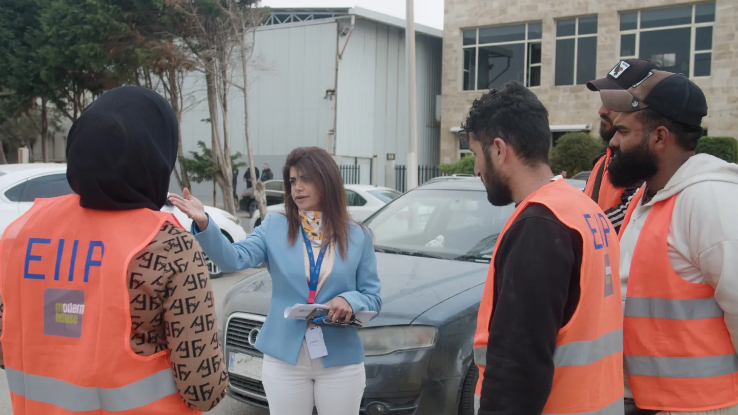 Rita Abou Jaoude, ILO EIIP Senior Environmental & Social Coordinator interacting with workers. Tripoli, Lebanon -April 2025