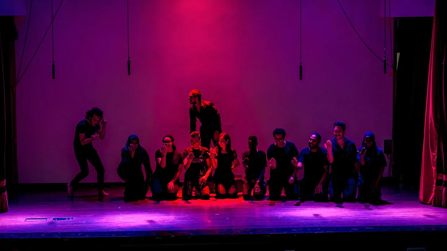 Theatre workshop participants performing a musical 