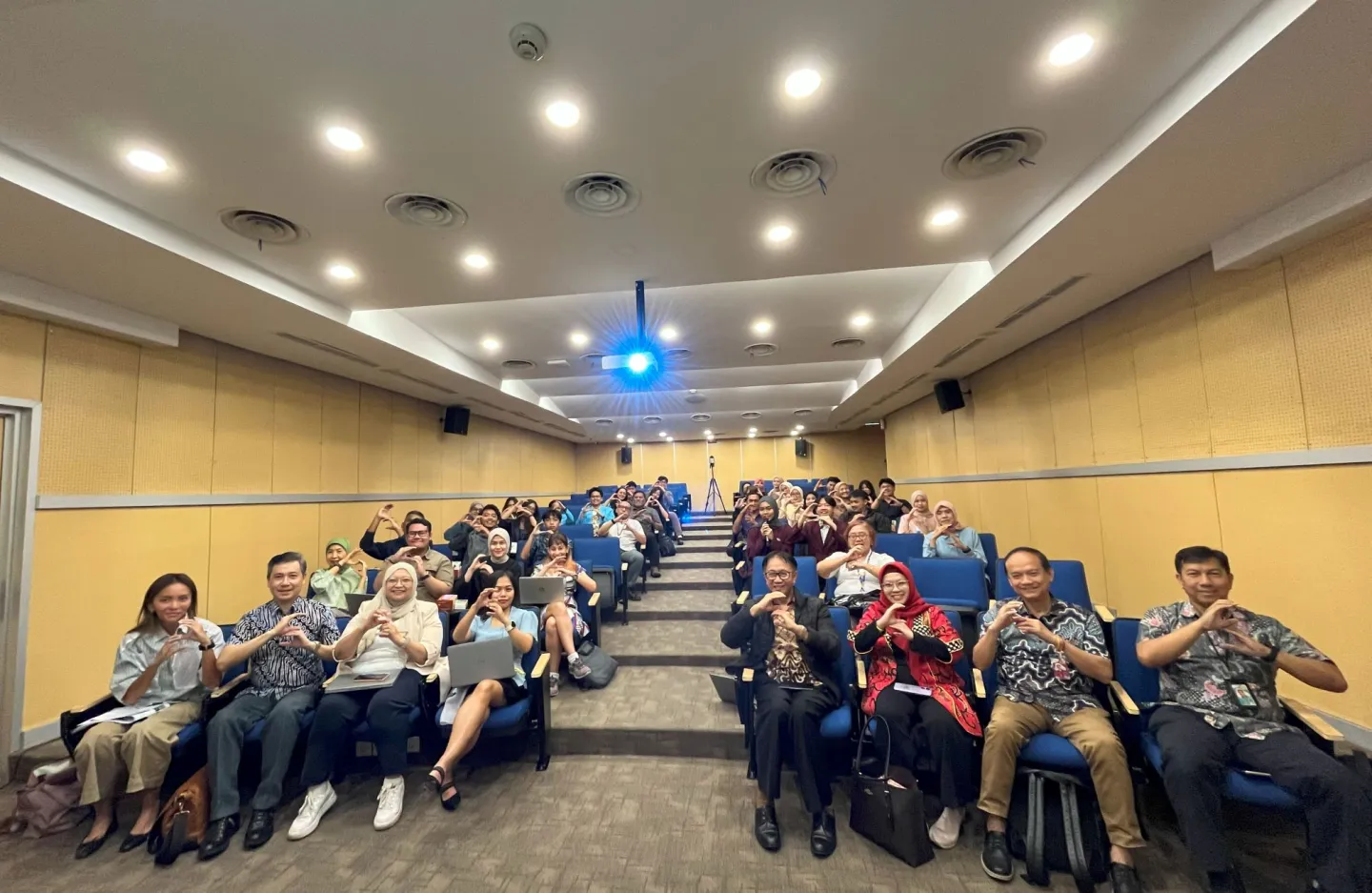 A group photo with people sitting