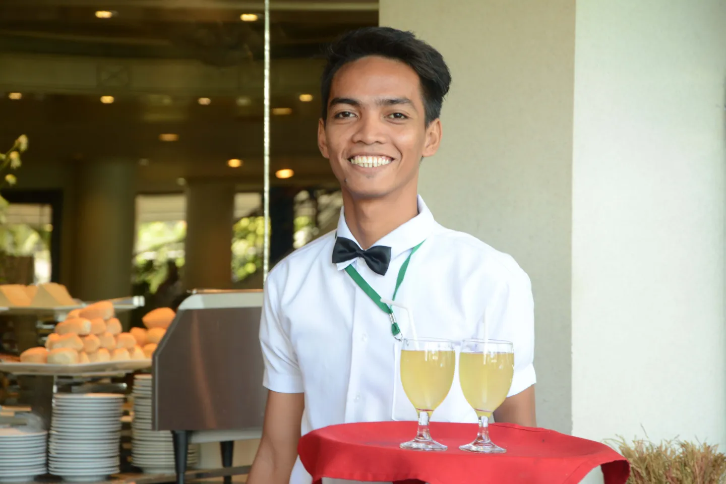 a young male working in a restaurant of a hotel
