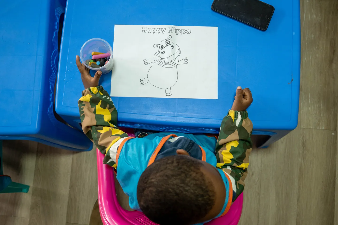 One of the children at the Mwariro Market Day care centre, face hidden to protect their identity