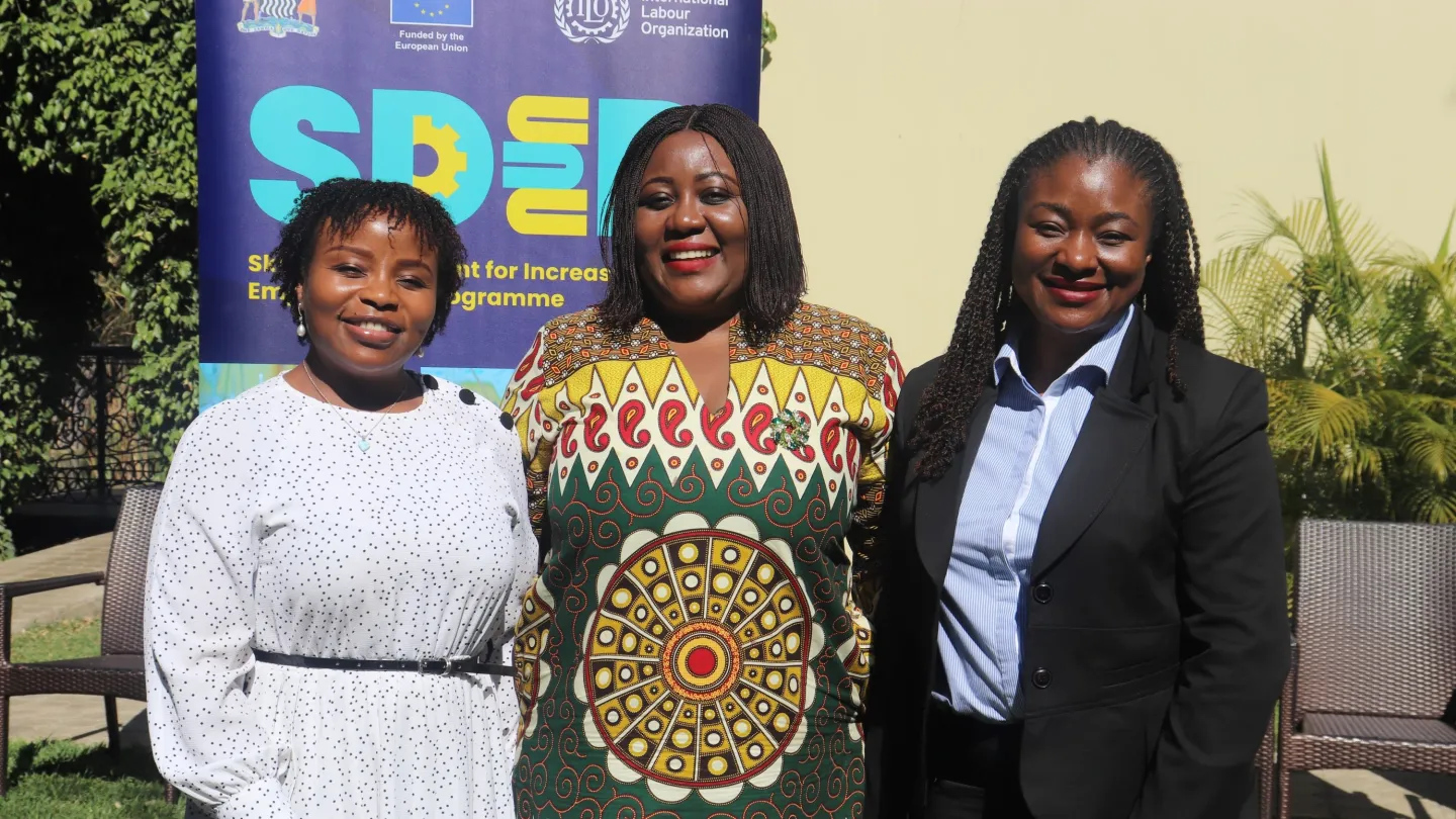 Ms. Mulemwa Moongwa (middle) pose for the photo with other participants.