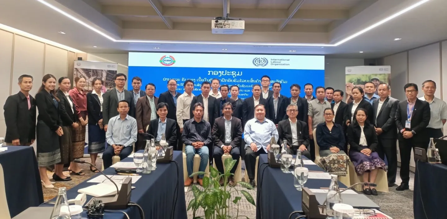 Group photo in a meeting room. 