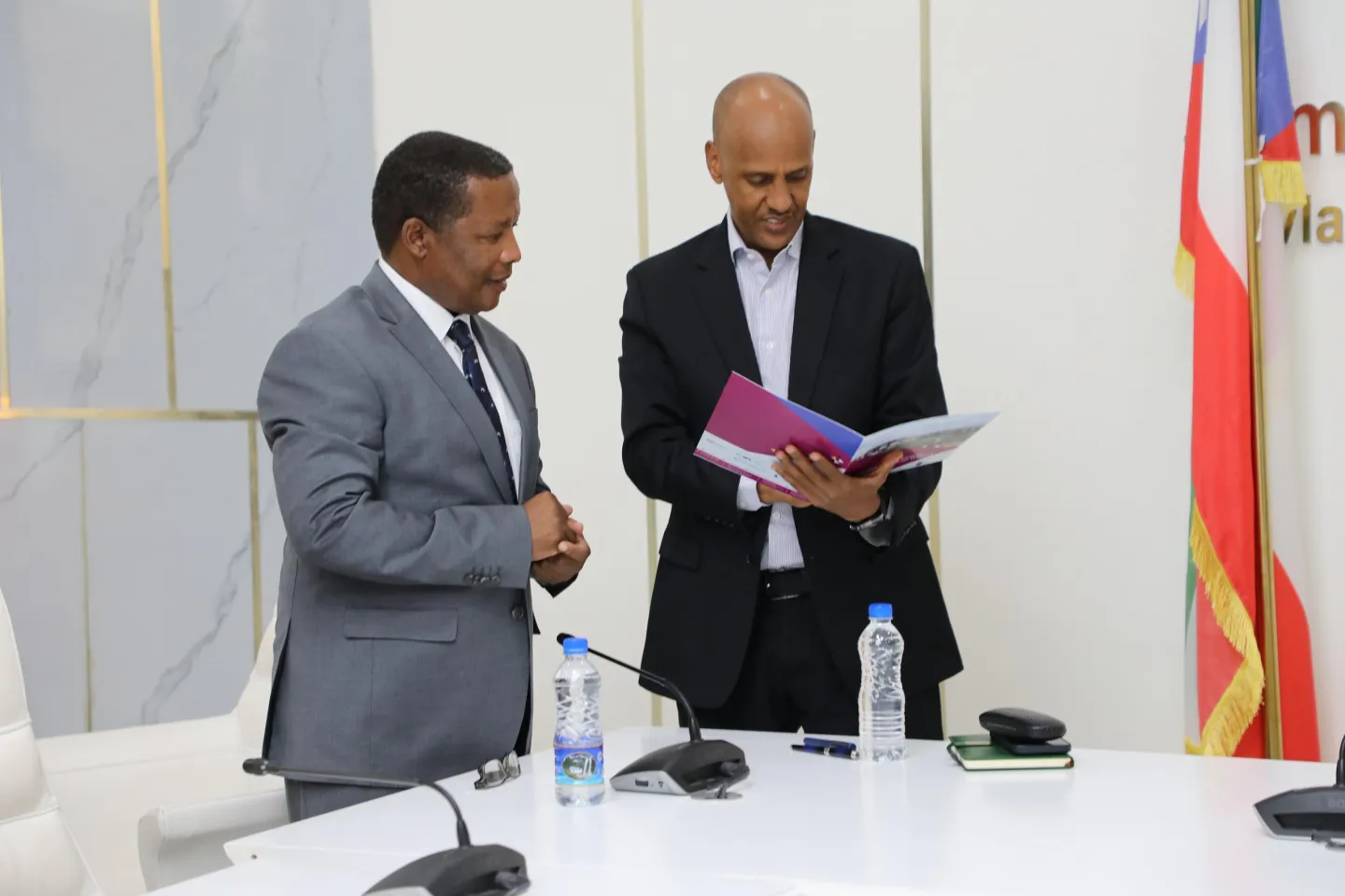 ILO and Somali region officials looking at a publication 