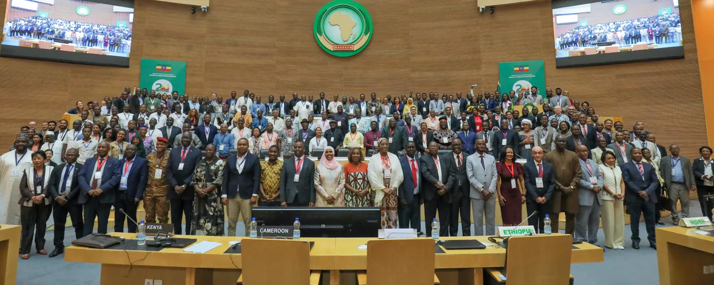 Group photo of participants in the conference hall.