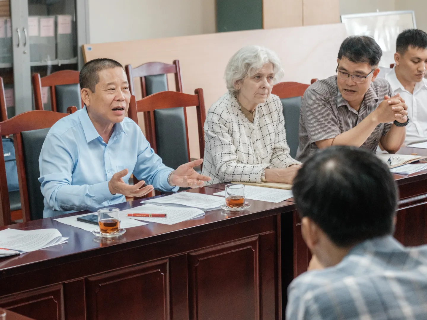 The ILO team, led by Country Director Ingrid Christensen, meets with Lao Cai authorities to discuss the implementation of the Cash for Work programme supporting communities affected by Typhoon Yagi