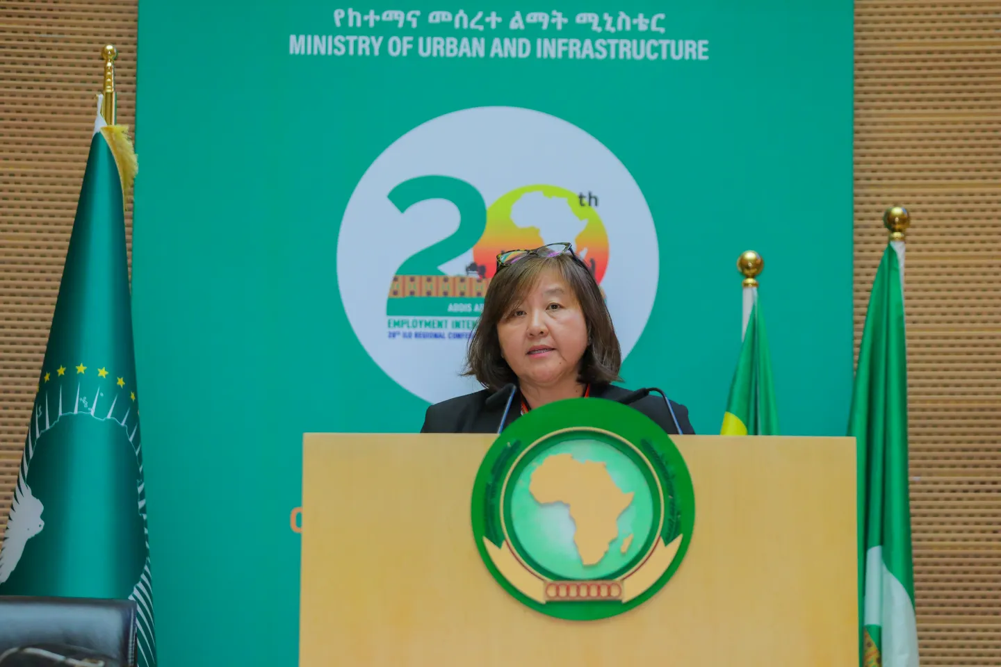 Woman standing at a podium
