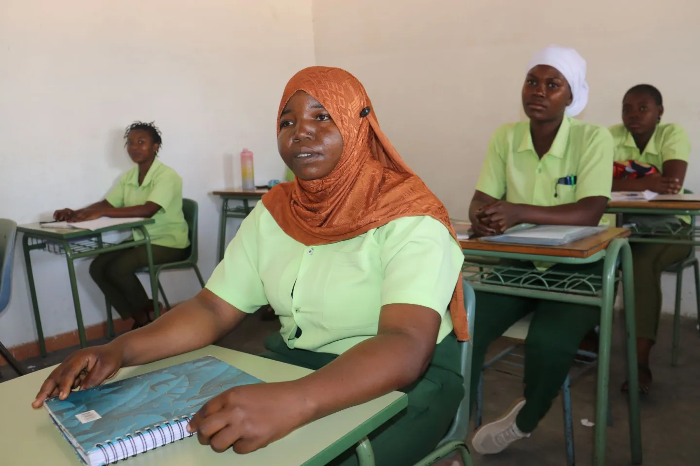 Students attending lessons in the classroom.