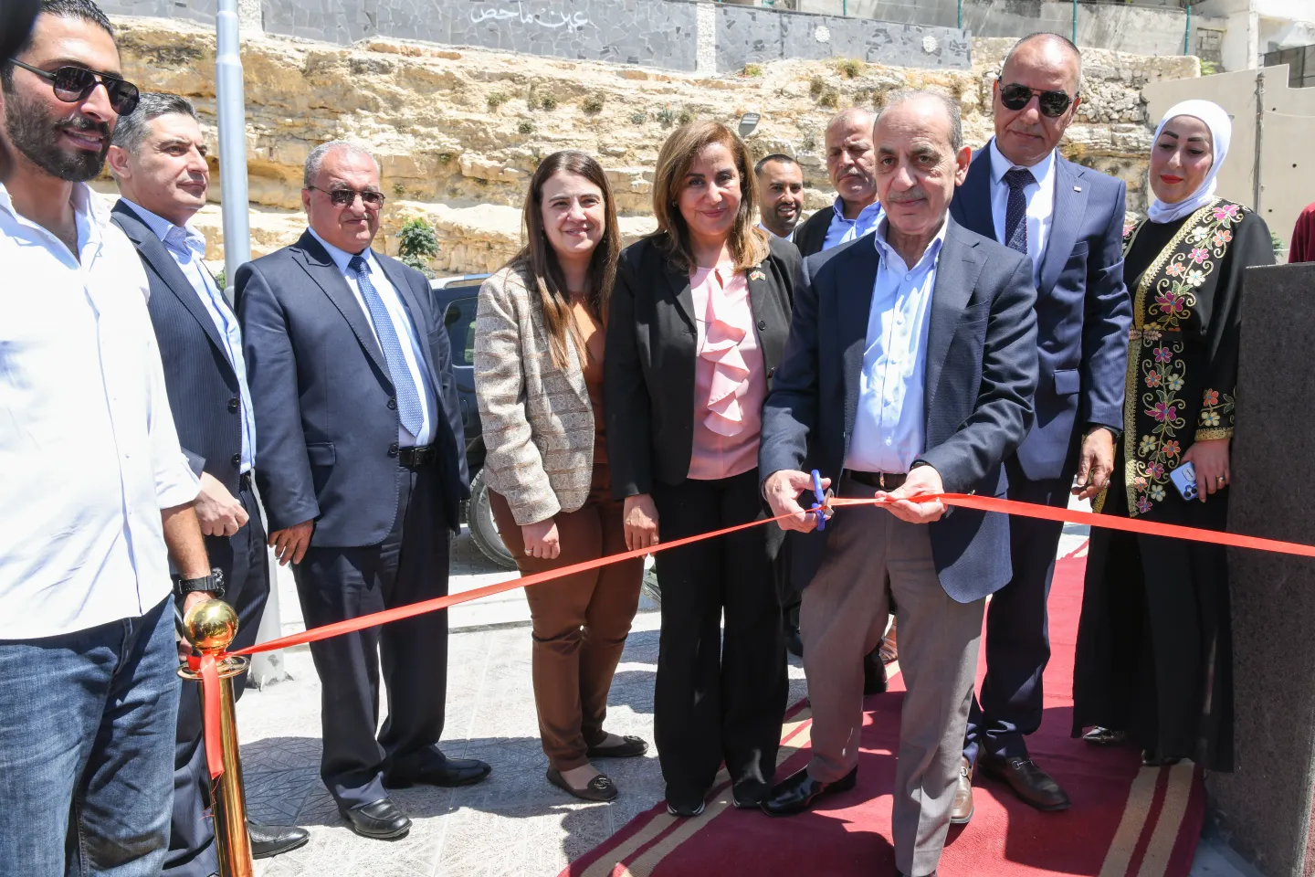 HE Minister of Local Administration Engineer Walid Al Masri, Ms. Amal Mowafi ILO Country Coordinator & Dr. Assia Al Dhabi KfW Opening Mahis Project, Jordan cutting the ribbon to the center.