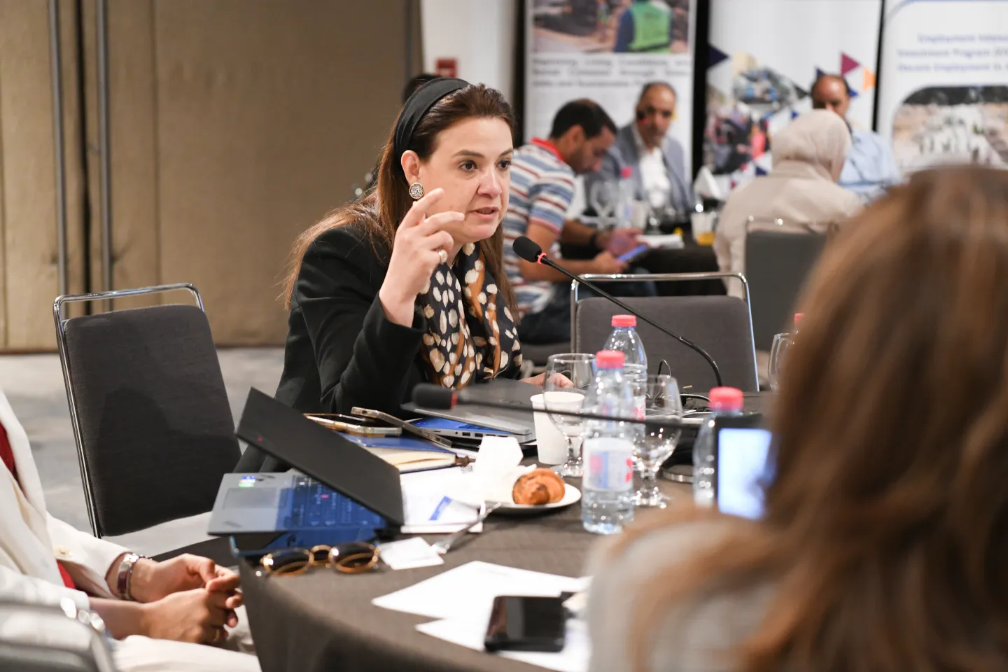 Amal Mowafy, ILO Jordan Country Coordinator and Senior Regional Employment Policy Specialist for the Arab States, discussing the National Workshop on Public Works. Jordan, 09/2025. 
