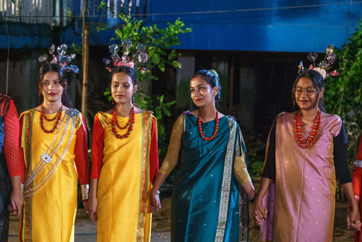 Tourists enjoy an evening of traditional music and dance at a community cultural show