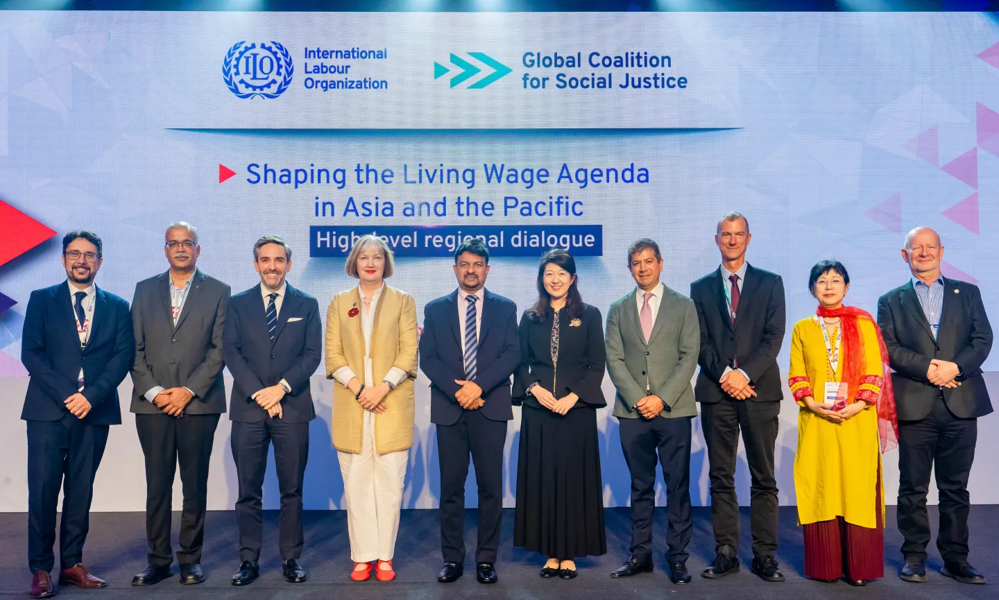 Group photo of people standing on a stage. 