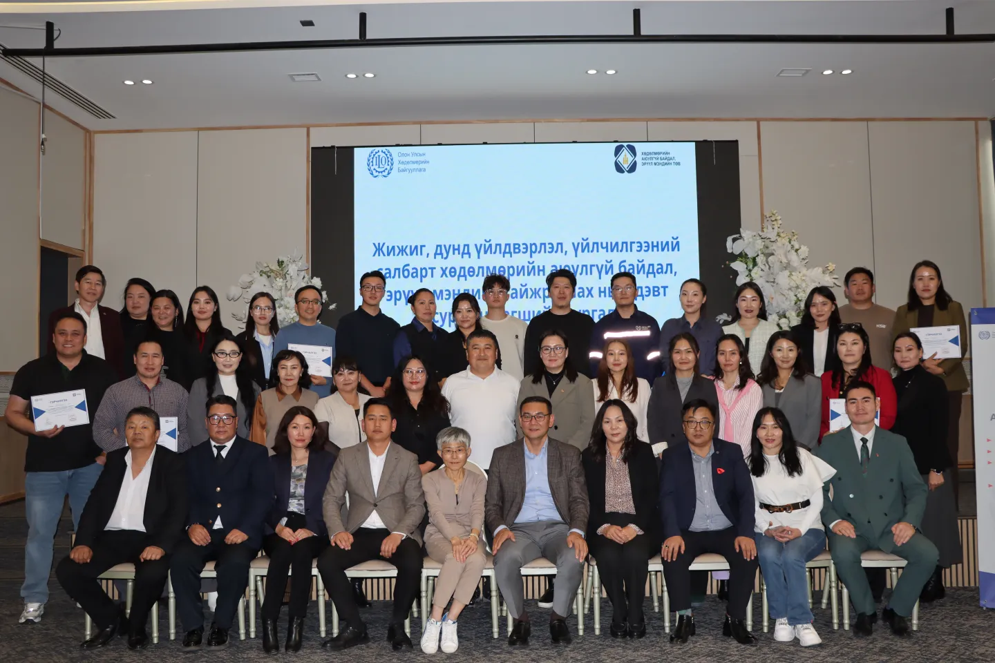 Participants receiving their certificates of participation after the two-day training of trainers