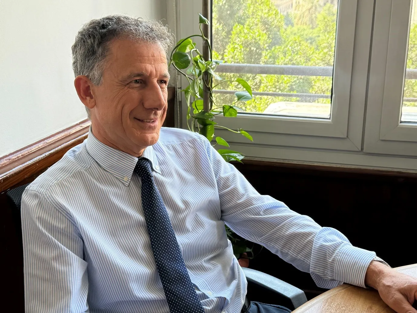 Image of AICS Director in Cairo smiling.