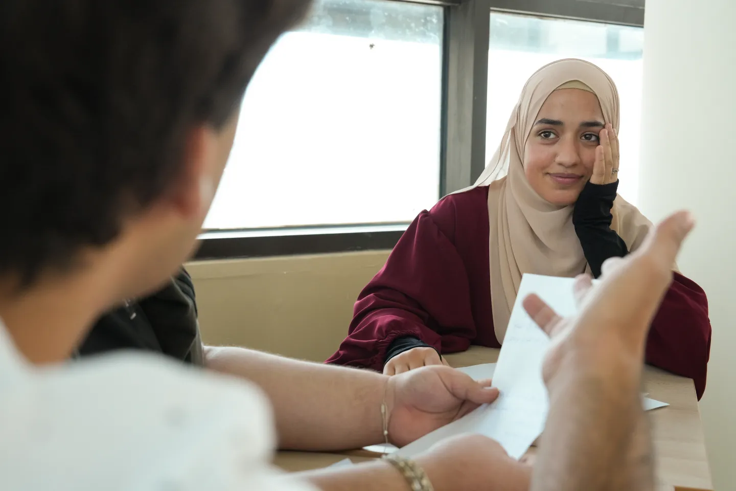 Young woman from Lebanon listening to trainer