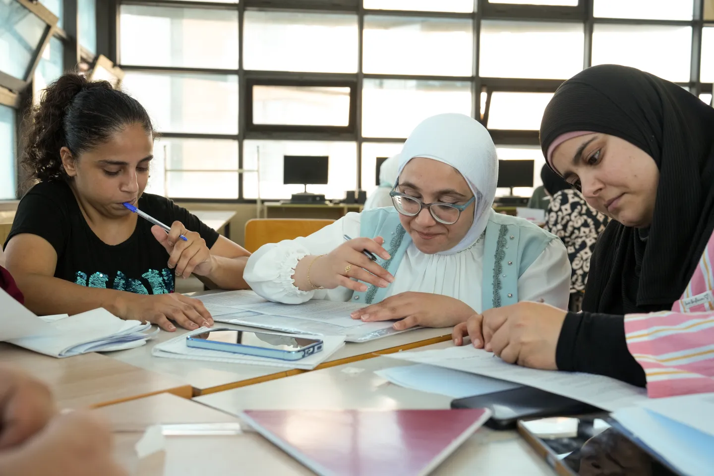 young women writing CV