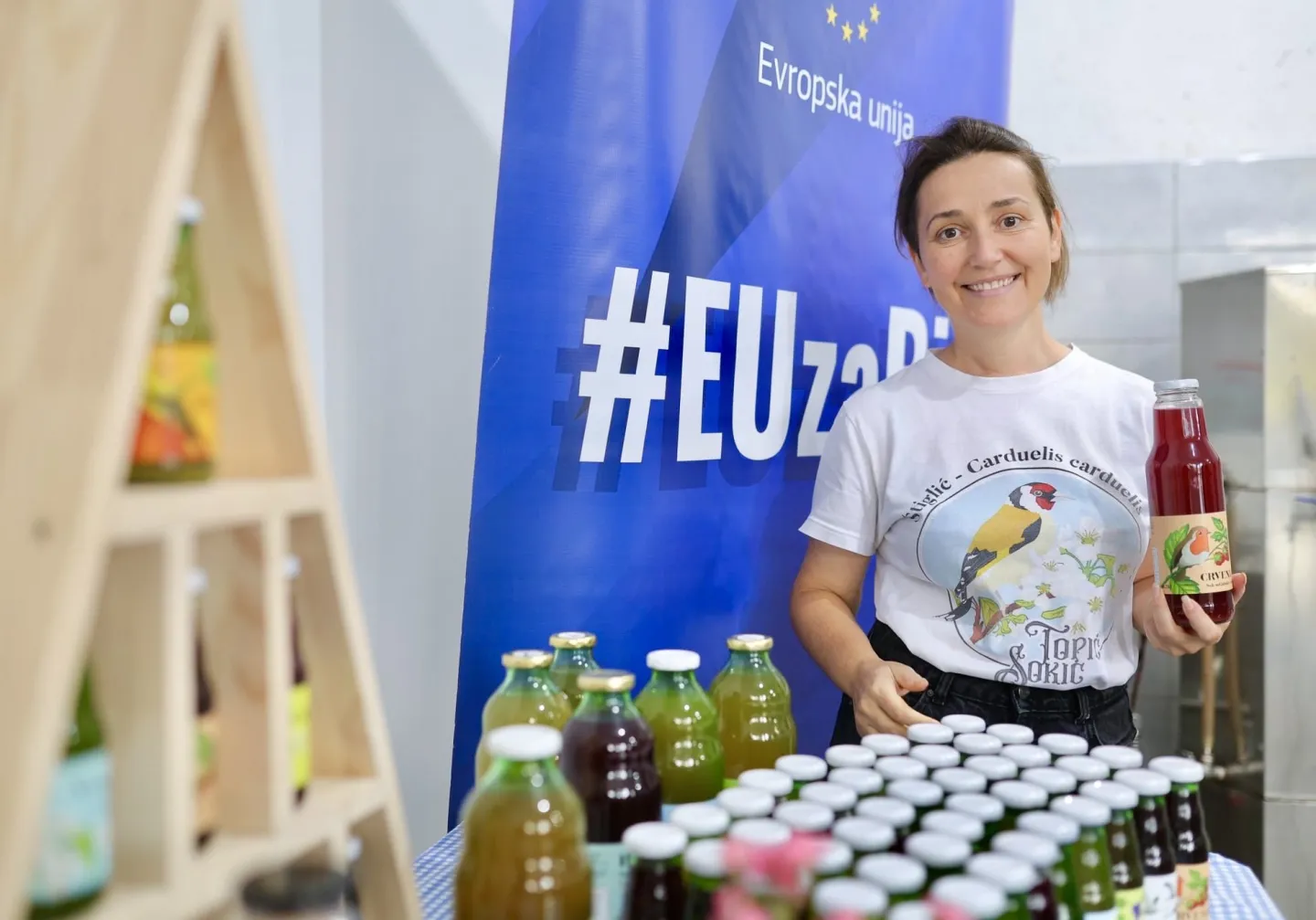 Young woman with bottles of fruit juice