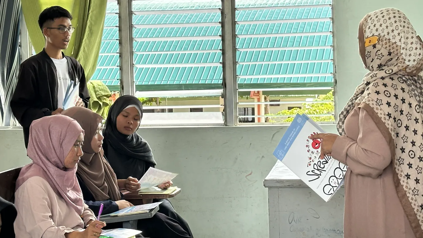 college instructor wearing hijab with her students