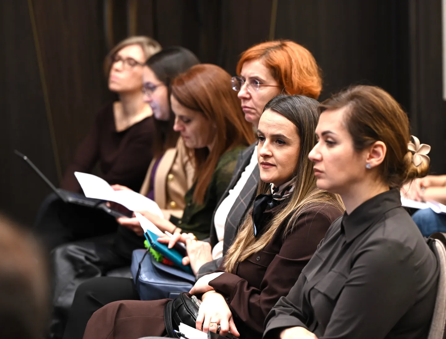 Six women sitting down listening to the lecture at the just transition dialogue launched by the Montenegrin employers