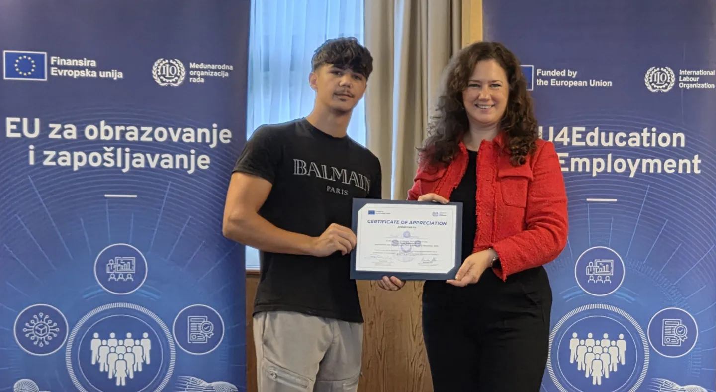 Student receiving a certificate