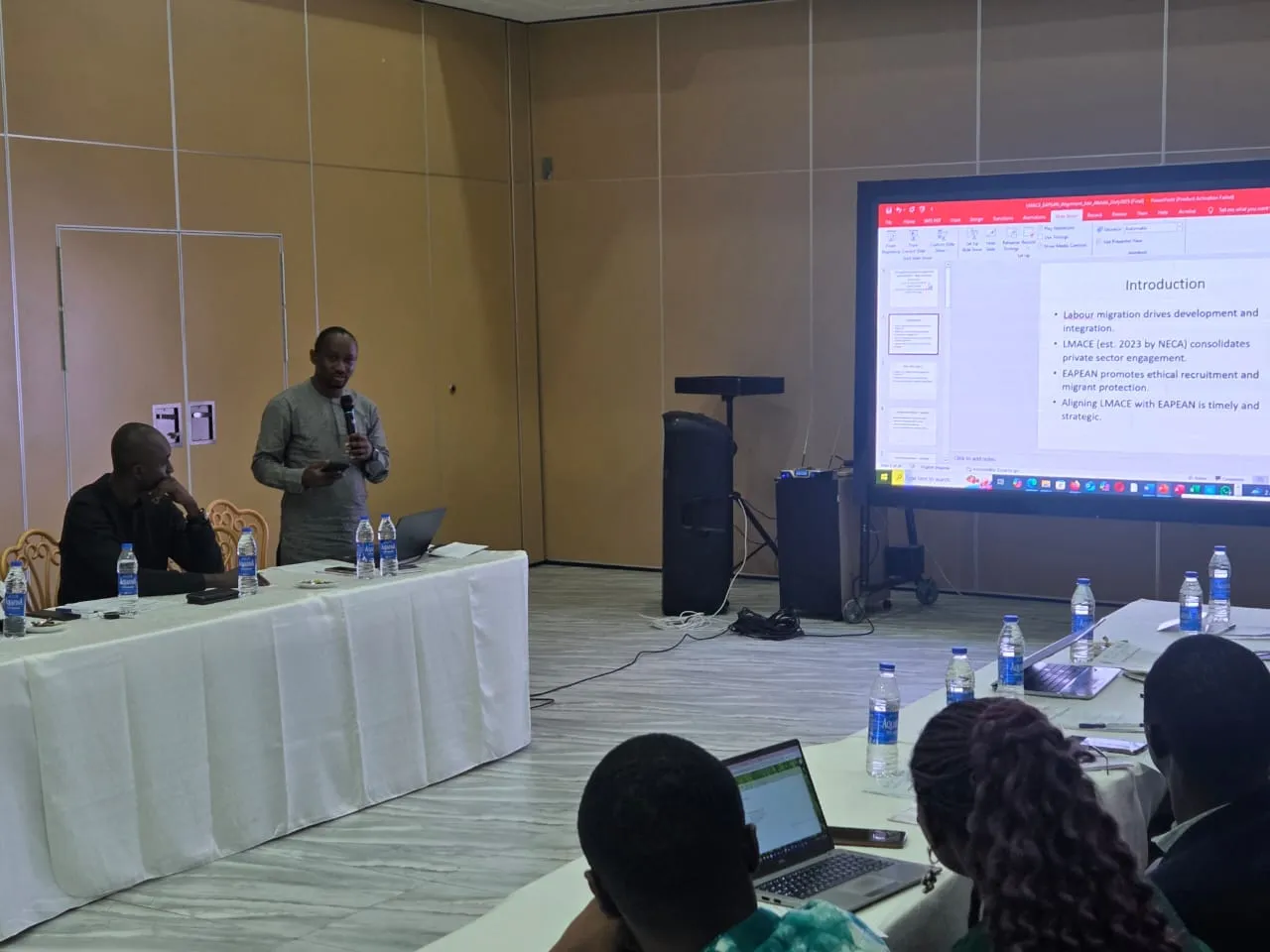 A presentation being made on a screen to participants at the Labour Migration Advisory Committee for Employers (LMACE) meeting
