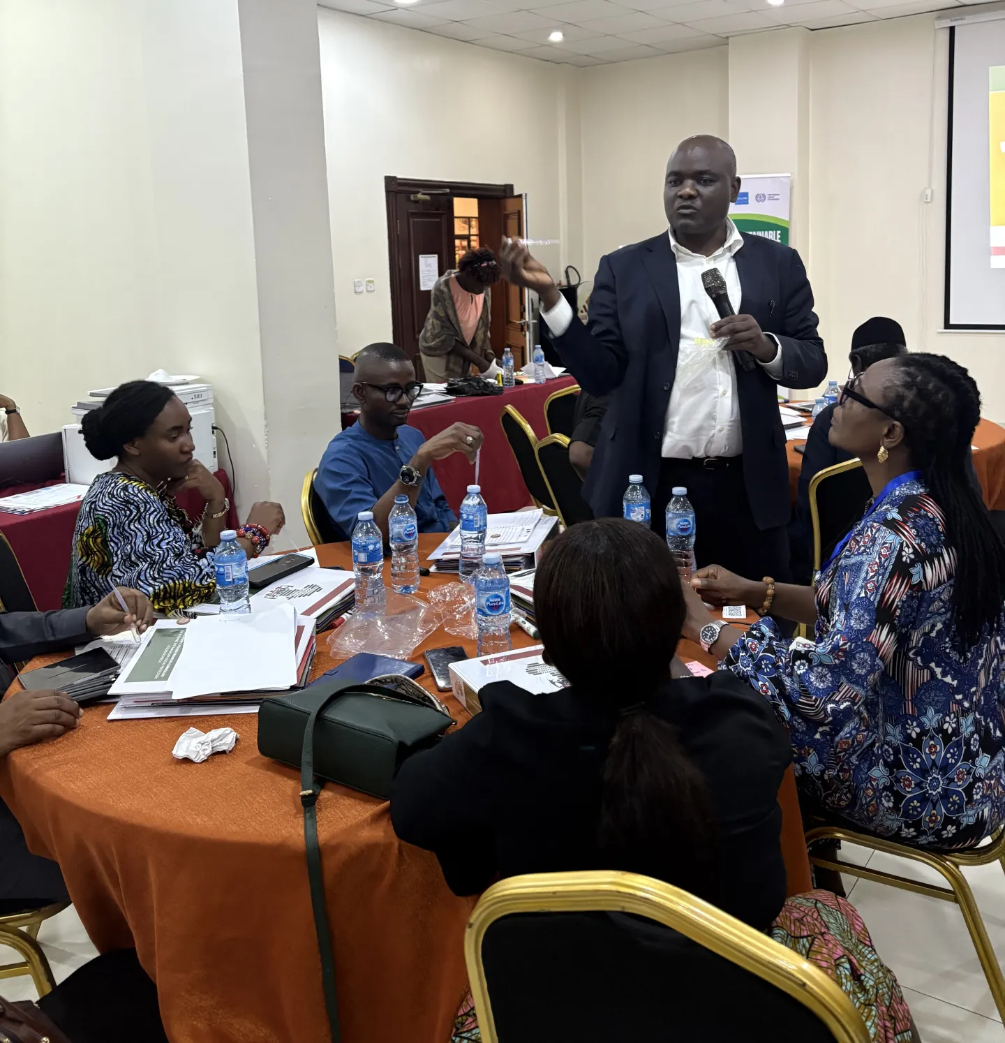 A facilitator engages participants during the ILO TRANSFORM Training session, fostering interactive discussions on building inclusive social protection systems in Nigeria.