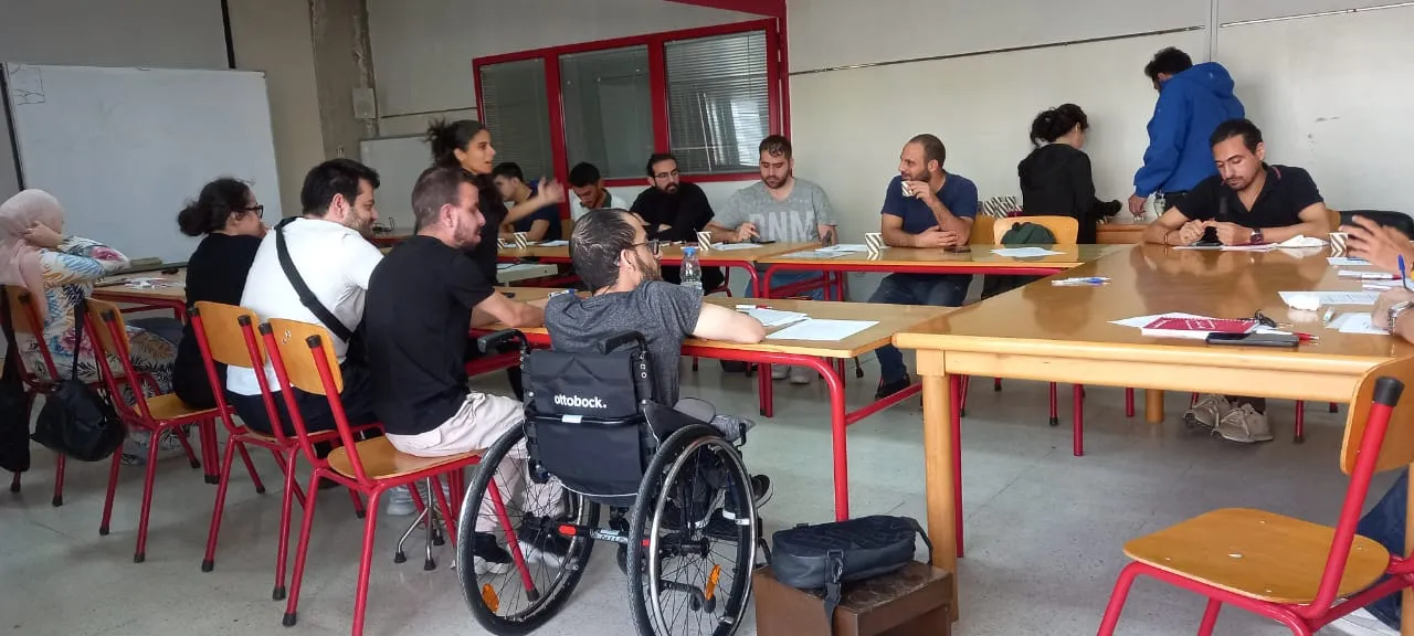 Charbel participates in the career preparedness training session, actively engaging with peers from his wheelchair. Beirut, Lebanon- Novembre 2025