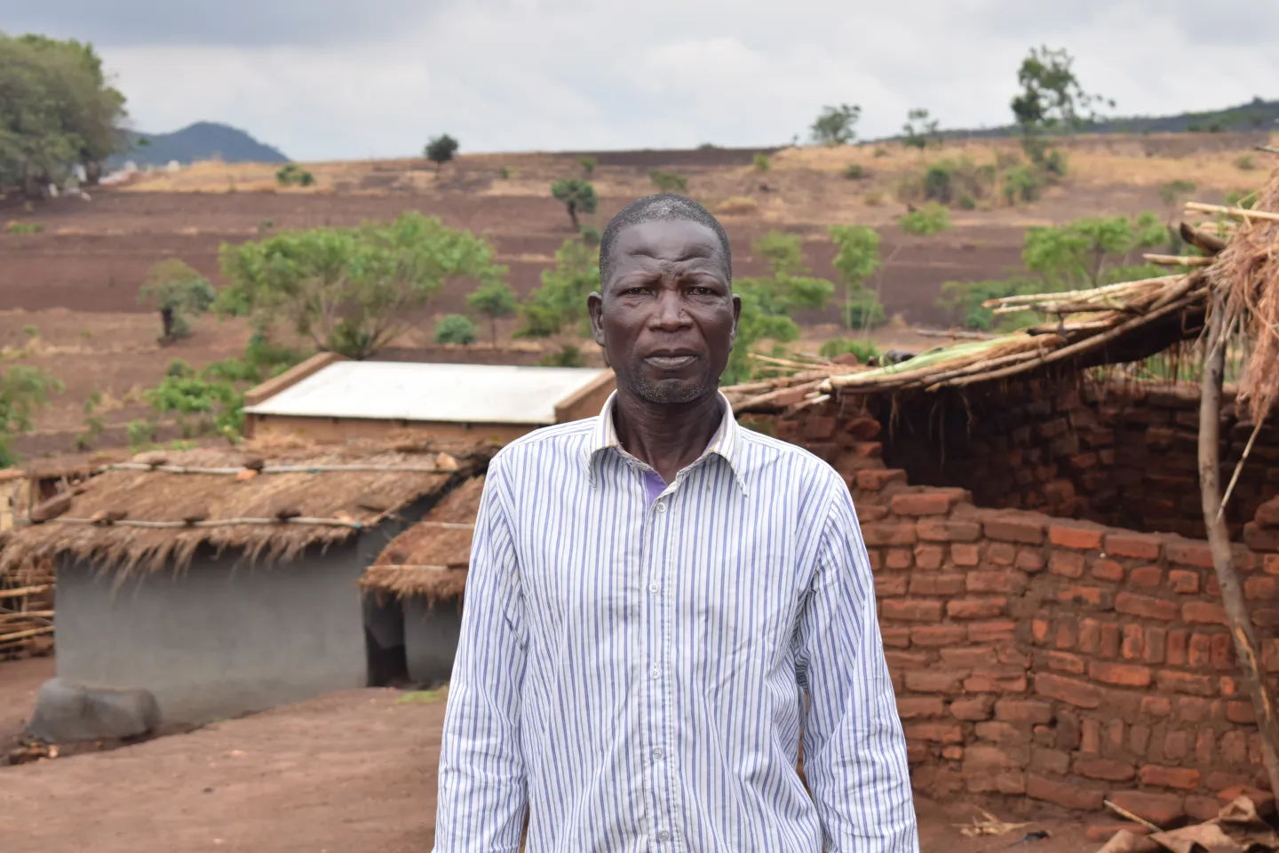 Ganizani Jekete, a 63-year-old coffee smallholder farmer from Mtchera Village in Ntchisi,