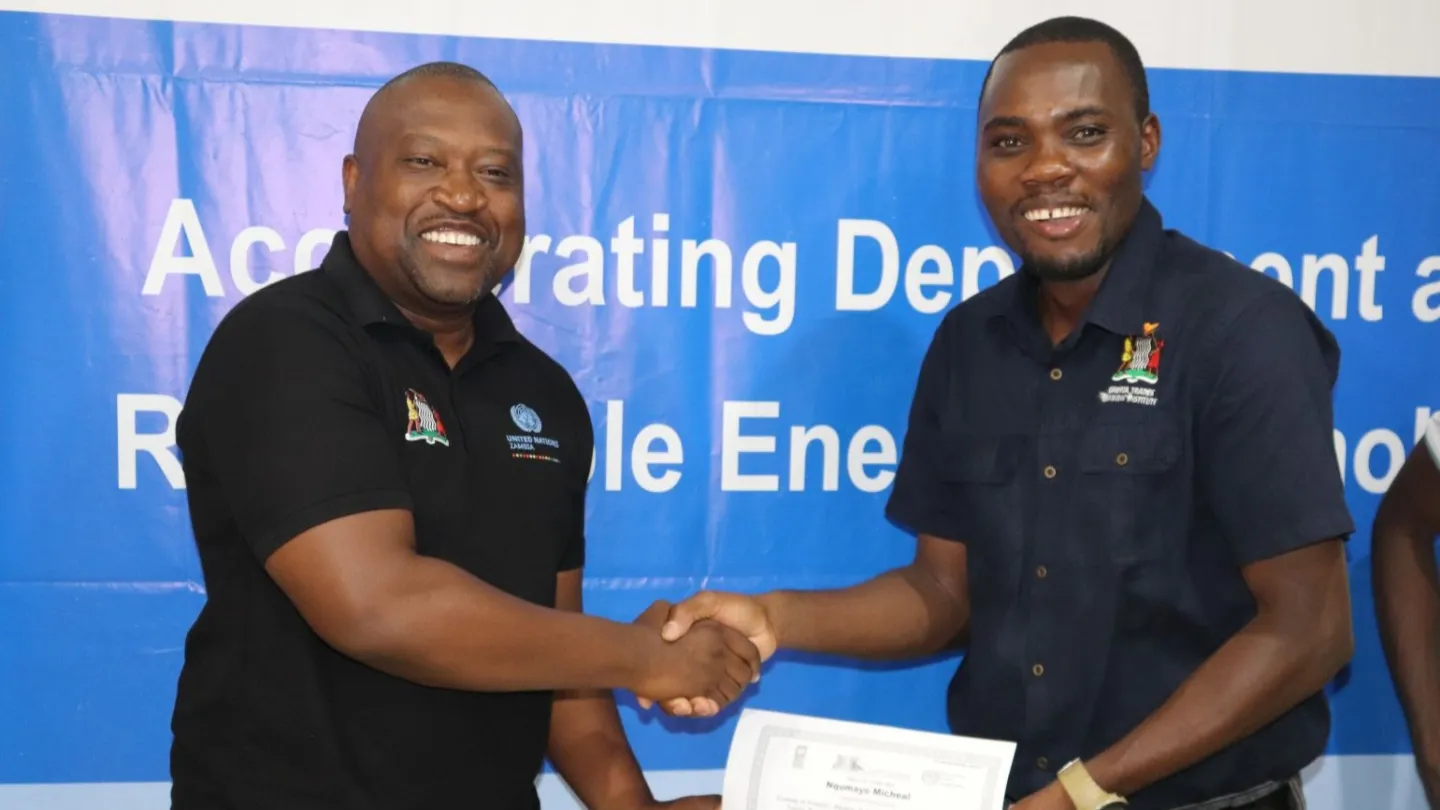 ILO Senior Programme Officer, Gerald Tembo awards a certificate of participation to Chipata Trades Training Institute lecturer, Michael Nqumayo during the training held in Chipata.