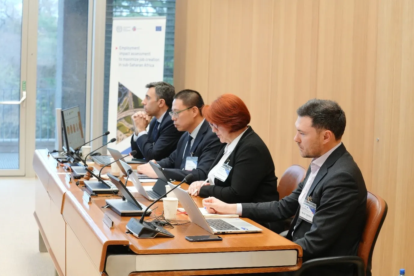 Three men and one woman panelists