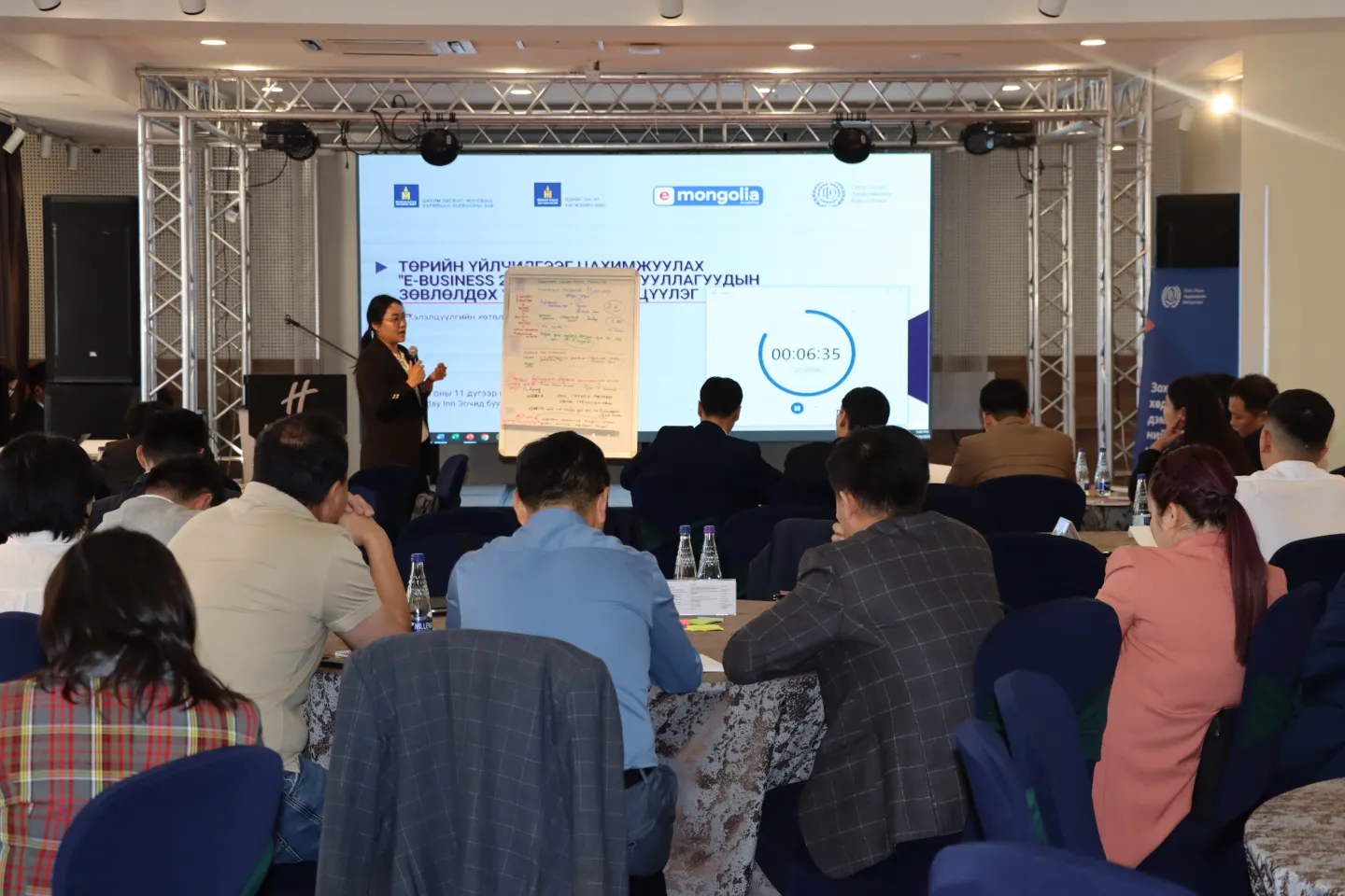 Ministry and agency officials are showing the results of their group work during a workshop toward the e-business platform development
