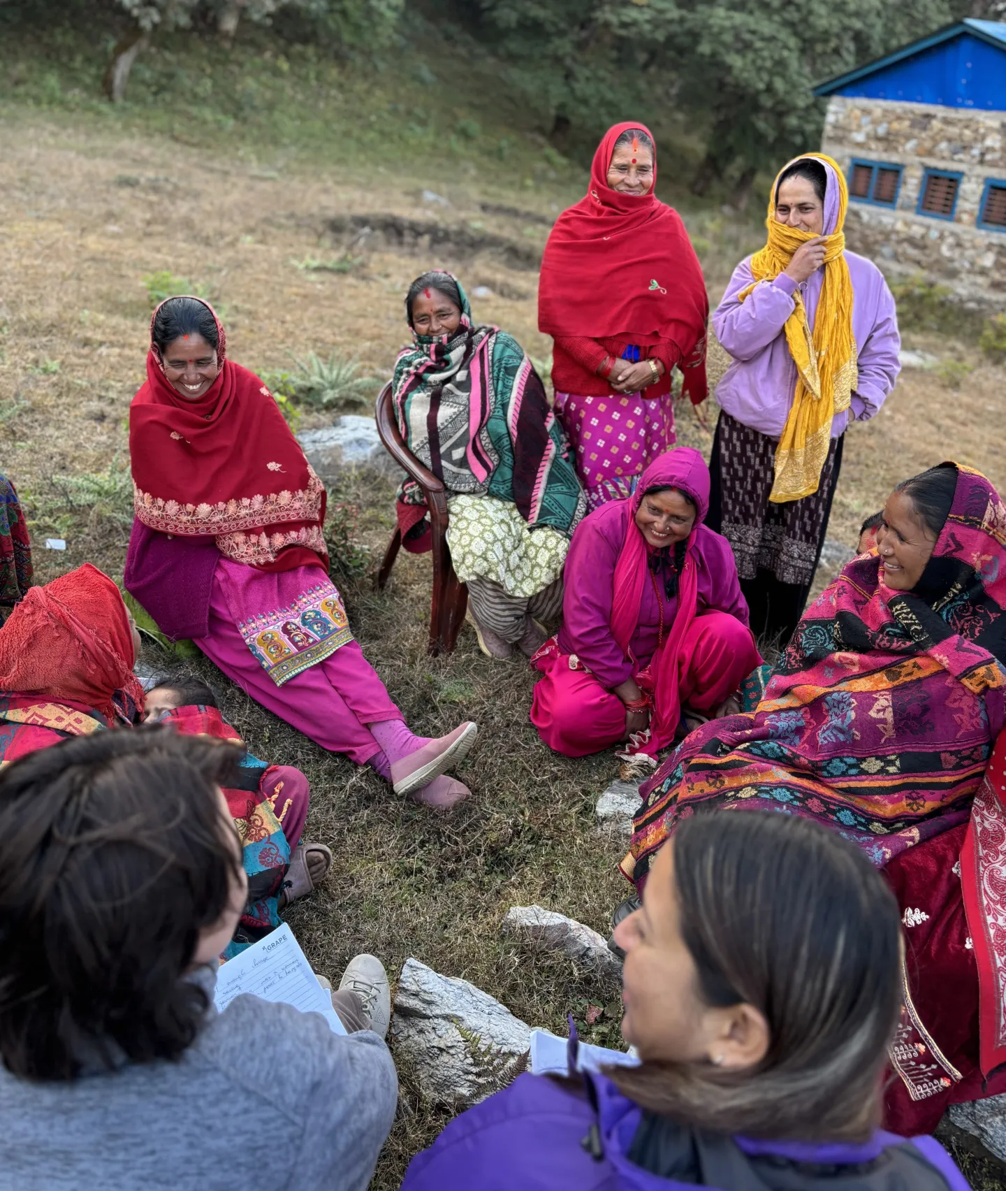 Women farmers in Nepal gather in the field for a meeting. 