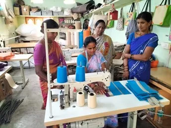 female entrepreneur from India and colleagues making jute products