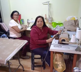 Peruvian woman and work colleague in their workplace
